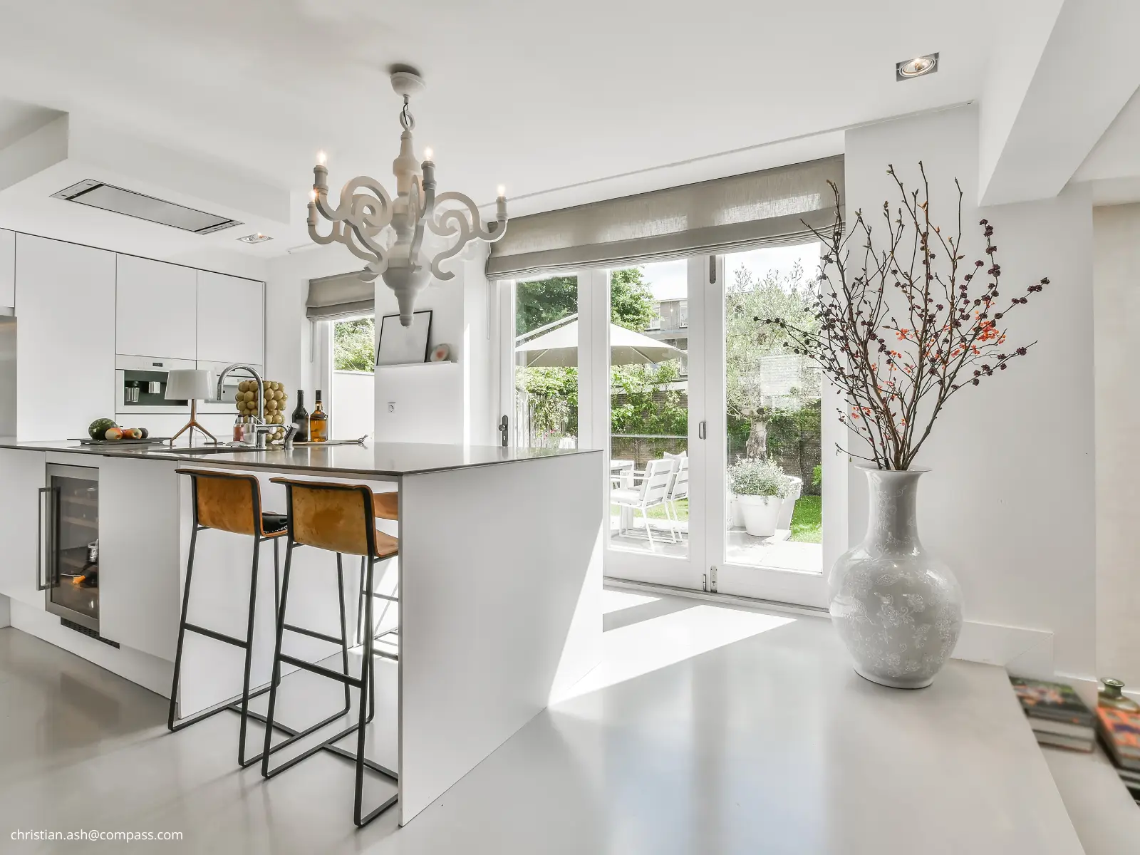 Bright, contemporary kitchen opening onto a garden in a Palm Beach County home