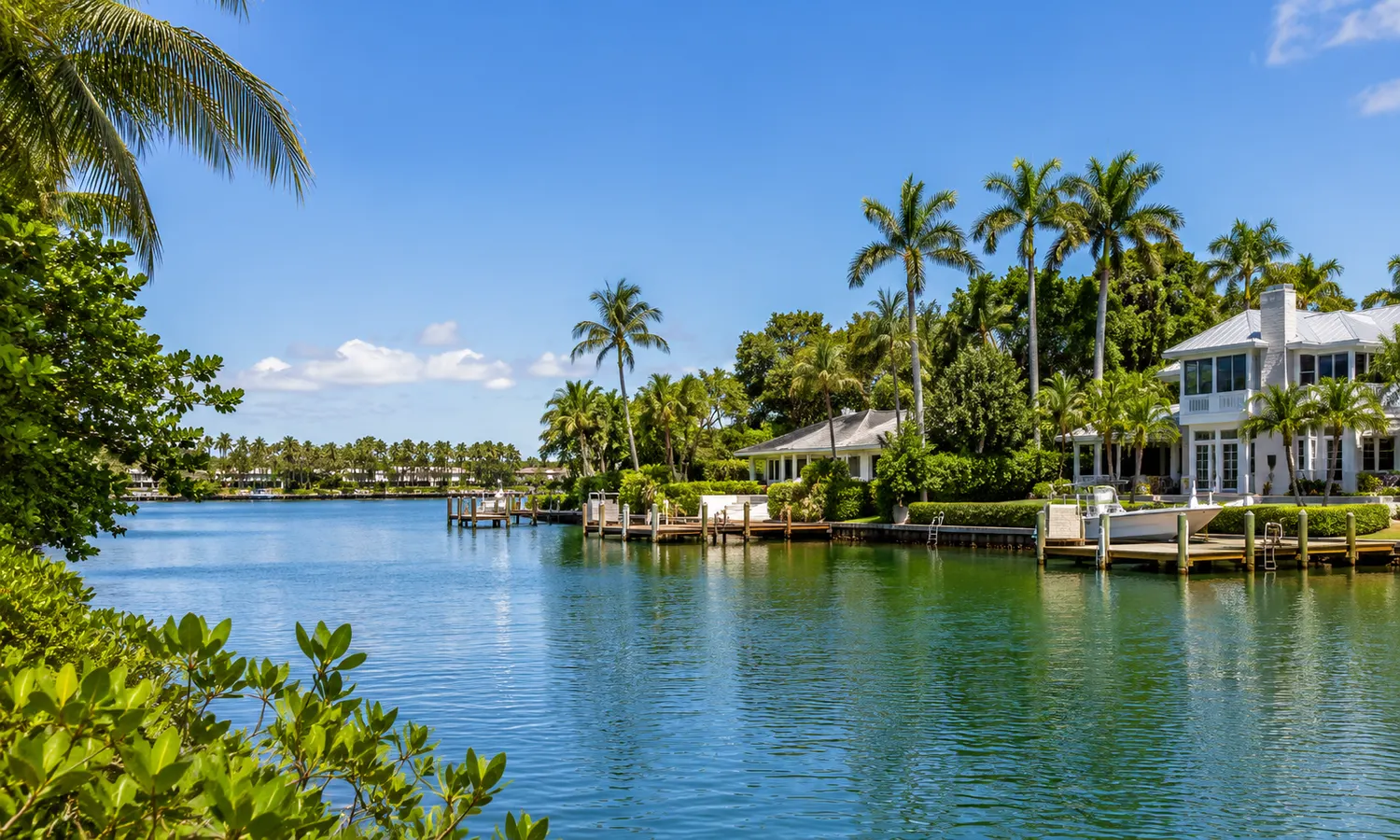 Illustrated river and village setting representing Tequesta, Florida